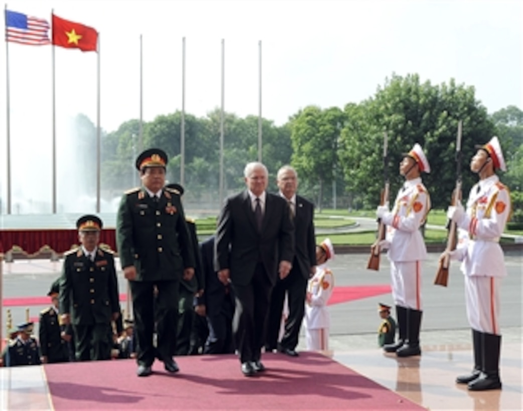 Secretary of Defense Robert M. Gates walks with Vietnamese Minister of Defense Gen. Phung Quang Thanh during a Guards of Honor Ceremony commemorating the official U.S. visit to the Vietnamese Military headquarters in Hanoi, Vietnam, on Oct. 11, 2010.  