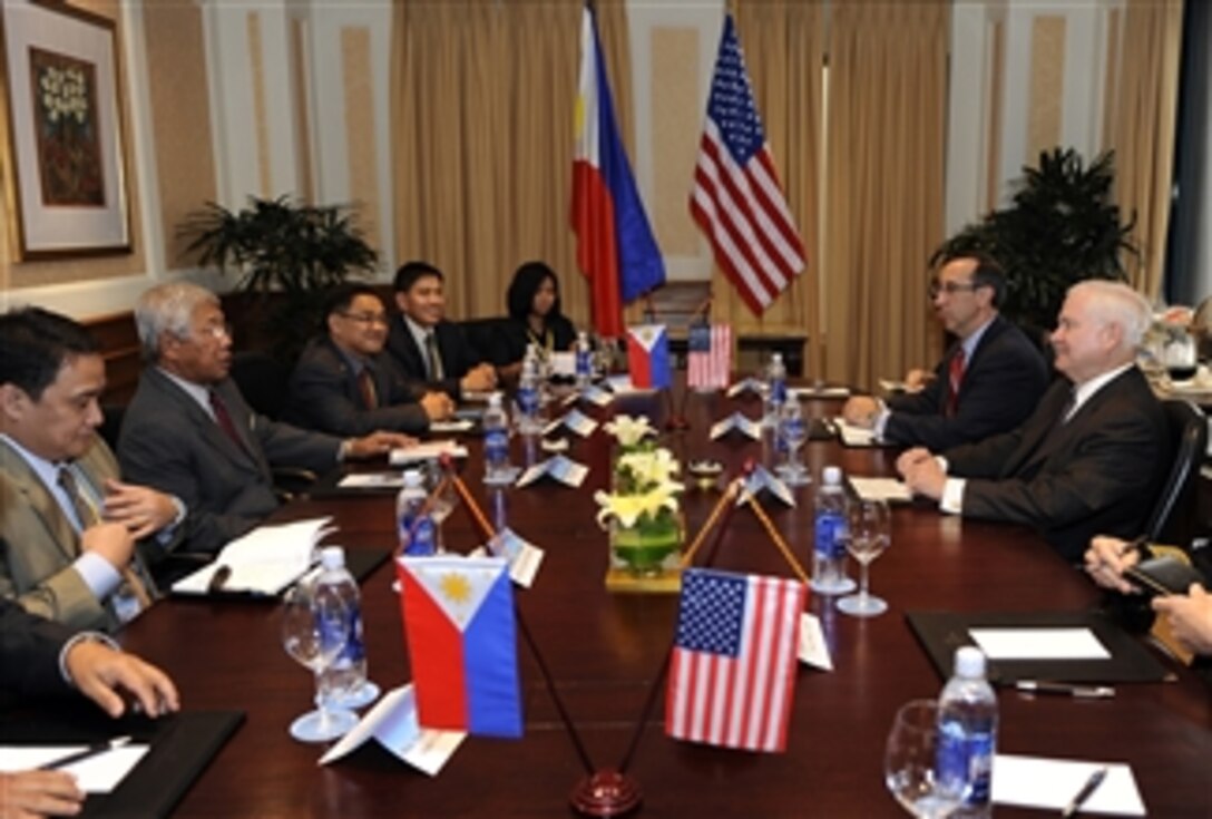 Secretary of Defense Robert M. Gates and Philippine Minister of Defense Voltaire Gazmin hold a bilateral meeting in Hanoi, Vietnam, on Oct. 11, 2010.  