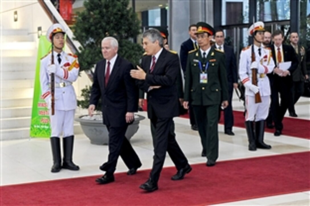 U.S. Defense Secretary Robert M. Gates, left, chats with Australian Defense Minister Stephen Smith during  the first “plus” defense ministers meeting of the Association of Southeast Asian Nations in Hanoi, Vietnam, Oct. 12, 2010.