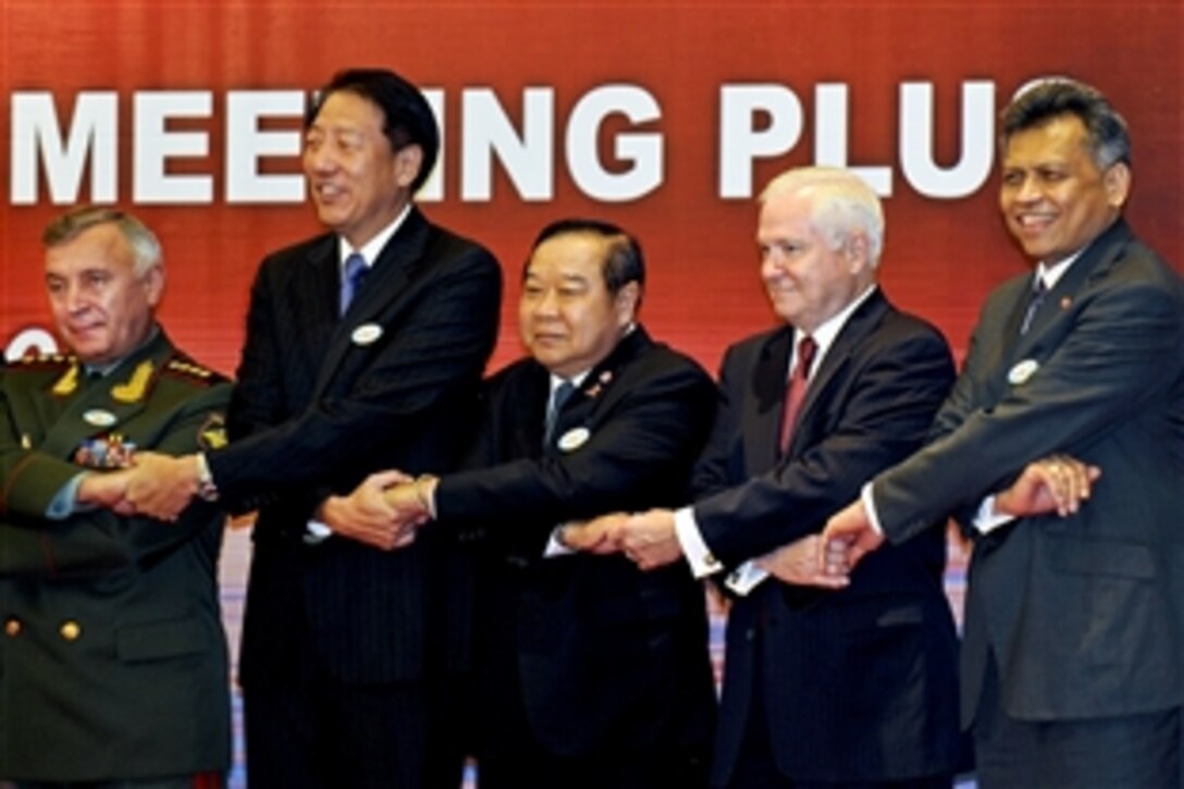 From left to right:  Russia's Deputy Defense Minister and Chief of Staff General Nikolai Makarov, Singapore's Defense Minister Teo Chee Hean, Thailand's Defense Minister Prawit Wongsuwan, U.S. Defense Secretary Robert M. Gates and Surin Pitsuwan, secretary general of the Southeast Asian Nations Defense Ministers, pose for a photo at the association's first "plus" meeting in Hanoi, Vietnam, Oct. 12, 2010.