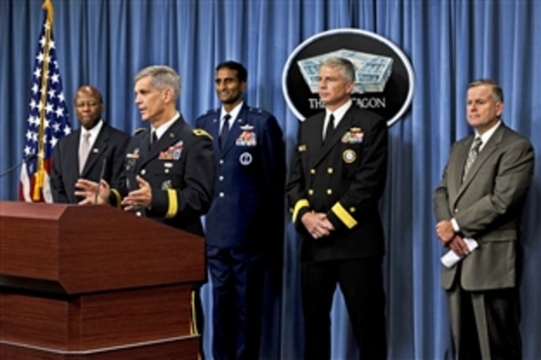 Clifford Stanley, left, undersecretary of defense for personnel and readiness, stands to the left as U.S. Army Maj. Gen. Donald M. Cambell, Jr., commanding general of U.S. Army Recruiting Command, briefs the press on recruiting and retention statistics for fiscal year 2010 at the Pentagon, Oct. 12, 2010. 