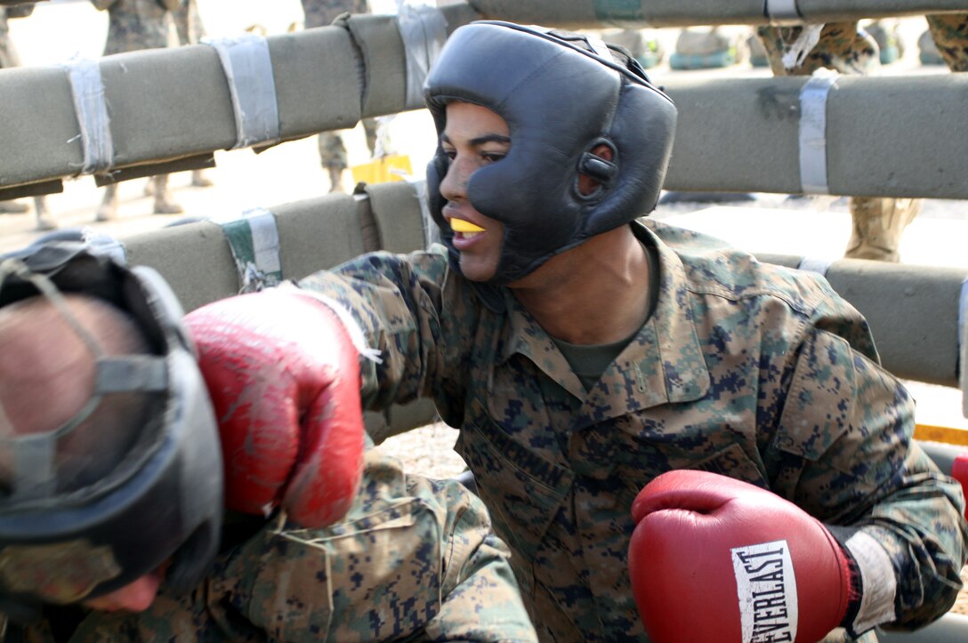 Recruit Myquel Zimmerman strikes his opponent during the body sparring portion of the Crucible Oct. 12. Zimmerman is from platoon 3207, Company I, 3rd Recruit Training Battalion, Recruit Training Regiment.