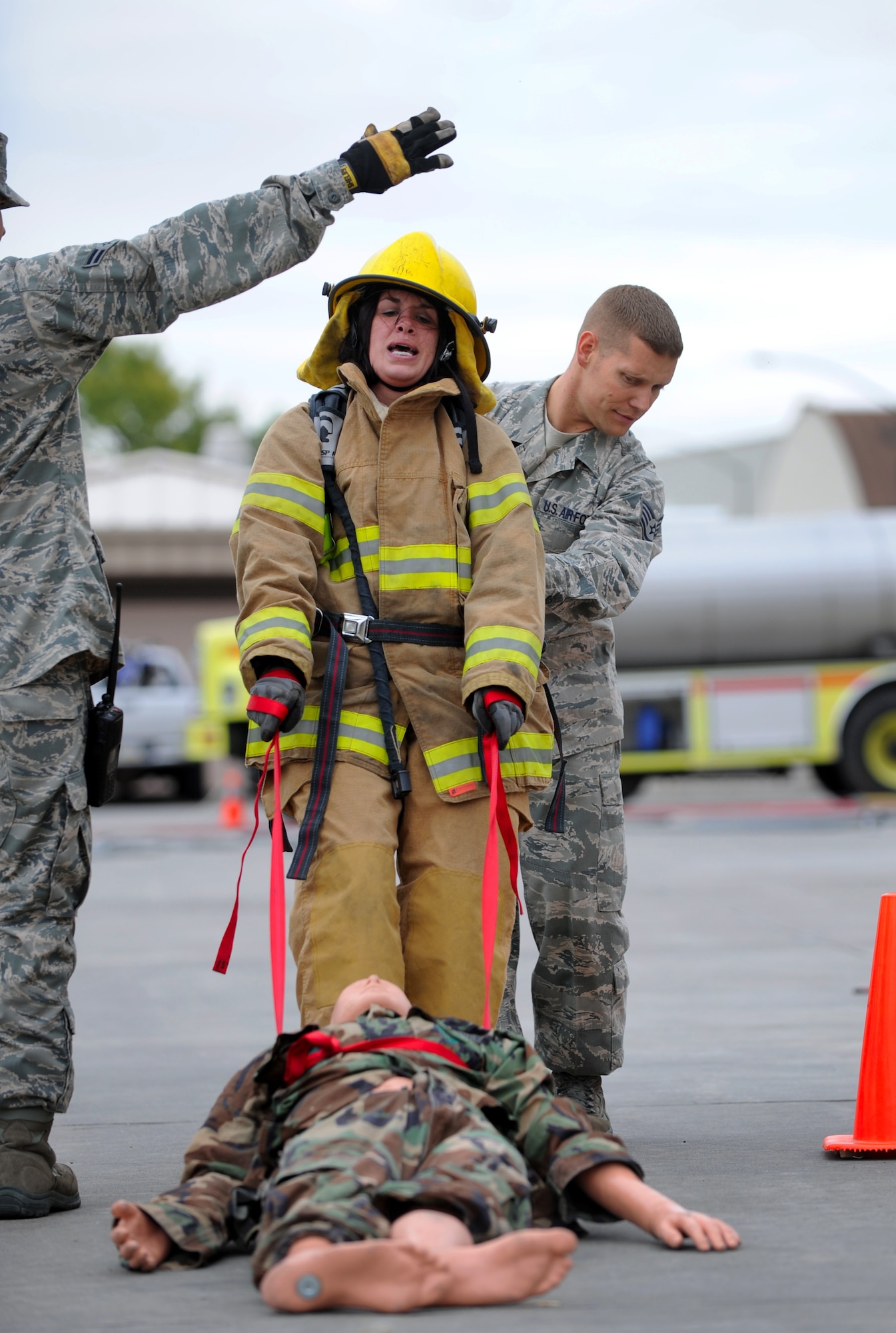 MOUNTAIN HOME AFB, Idaho -- Staff Sgt. Jessica Meyer, 366th Medical Operations Squadron noncommissioned officer-in-charge of the mental health clinic, carries a 185-pound dummy during a fire muster challenge here Oct. 8. Both men and women from around base participated in the challenge on four-man teams. (U.S. Air Force photo by Staff Sgt. Gina Chiaverotti-Paige)