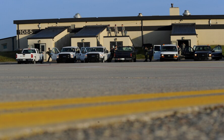 MINOT AIR FORCE BASE, N.D. -- Air Force Global Strike Command aircrews at Minot rush from the alert facility on the alternate parking area to their vehicles as they respond to the rapid launch portion of Prairie Vigilance 11-1 here Oct. 9. Exercises like these are integral to maintaining mission readiness and ensuring Team Minot is prepared to answer the call of the President of the United States and Combatant Commanders. (U.S. Air Force photo by Senior Airman Benjamin Stratton)