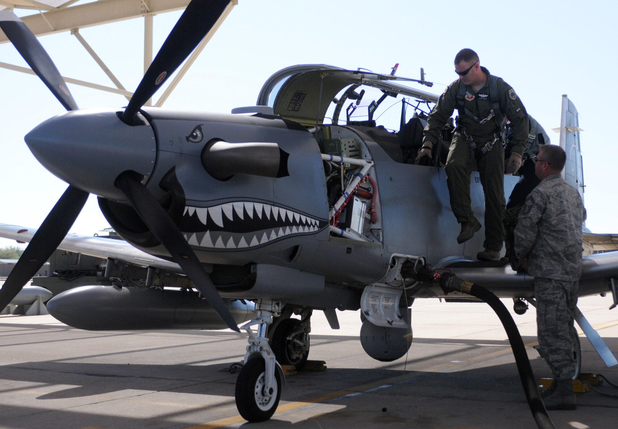 Maj. Jesse Smith, an A-10 pilot from the 422nd Test and Evaluation Squadron at Nellis Air Force Base, Nev., exits an AT-6C at Davis-Monthan Air Force Base, Ariz., after testing the light attack aircraft’s ability to perform a combat search and rescue mission Oct. 7. Major Smith is one of several pilots invited by the Air National Guard, Air Force Reserve Command Test Center to fly the experimental airplane this month and provide recommendations for improving its capability. (Air Force photo by Maj. Gabe Johnson)