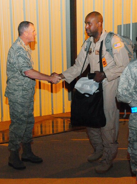 DYESS AIR FORCE BASE, Texas—Col.  Brian Donahoo, 7th Bomb Wing vice commander, shakes hands and bids farewell to 317th Airlift Group deployers Oct. 13 here. The Airmen deployed to Southwest Asia in support of Operation Enduring Freedom. (U.S. Air Force photo/Airman 1st Class Chelsea Cummings)