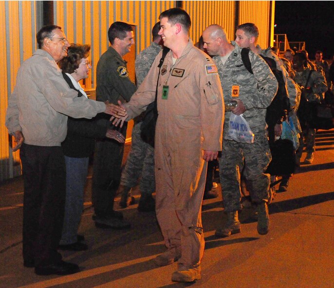 DYESS AIR FORCE BASE, Texas—317th Airlift Group deployers shake hands with 7th Bomb Wing and 317 AG leadership and honorary commanders as they bid farewell Oct. 13 here. The Airmen deployed to Southwest Asia in support of Operation Enduring Freedom. (U.S. Air Force photo/Airman 1st Class Chelsea Cummings)