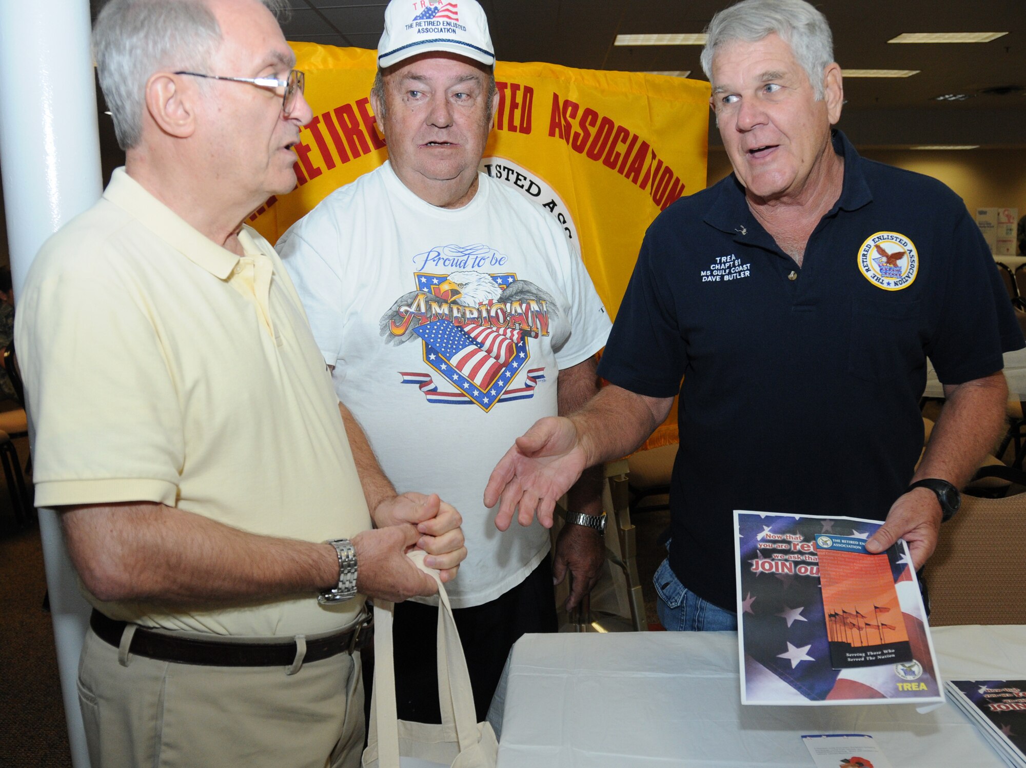 Air Force retirees MartinWuollet of Hattiesburg and Don Richardson and Dave Butler
of Ocean Springs discuss benefits of membership in The Retired Enlisted Association.  (U.S. Air Force photo by Kemberly Groue)