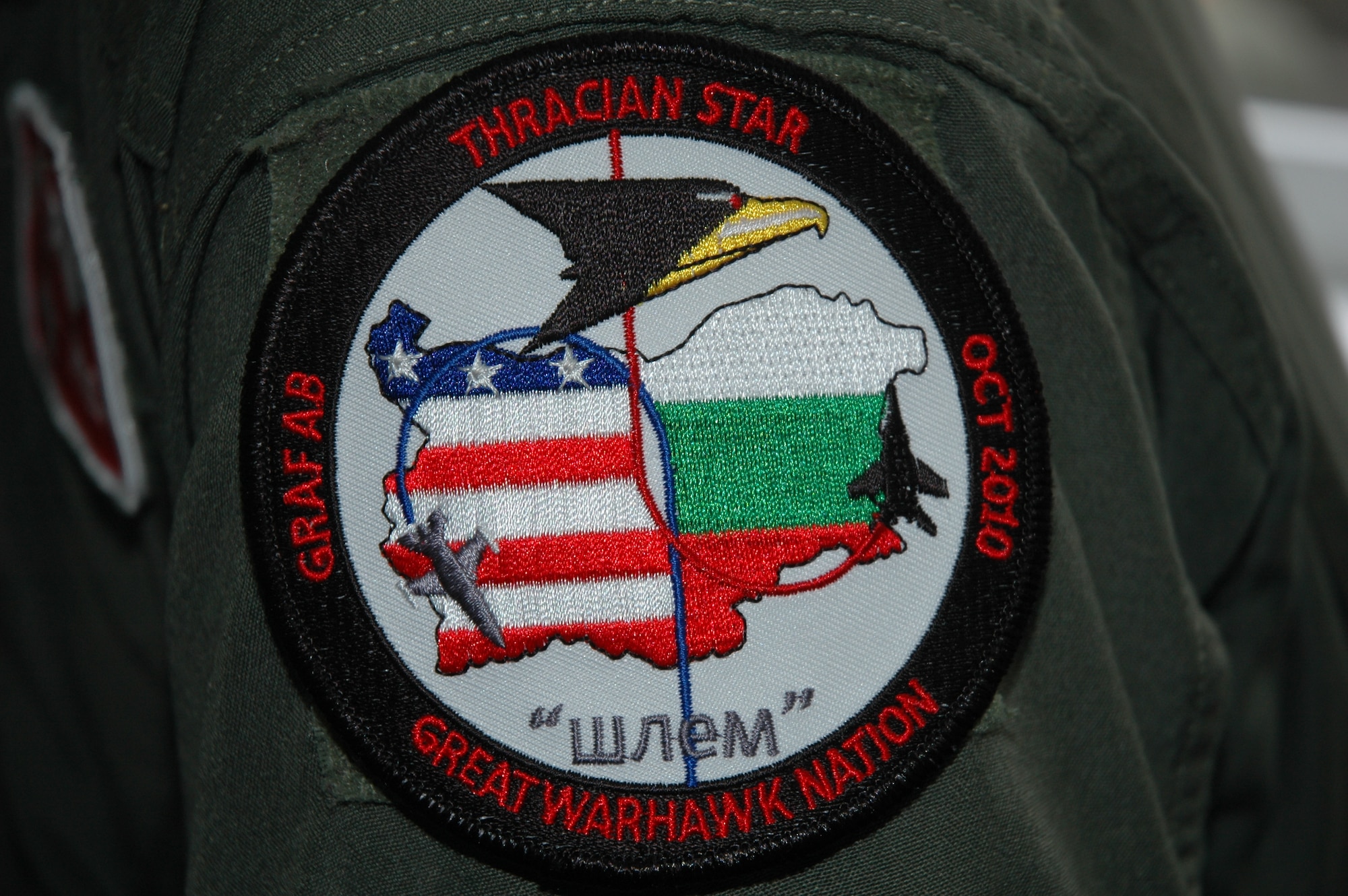 GRAF IGNATIEVO AIR FORCE BASE, Bulgaria -- An F-16 Fighting Falcon pilot from Spangdahlem Air Base's 480th Fighter Squadron wears a patch from Operation Thracian Star Oct. 13. The operation was a three-week combined exercise that gave both U.S. and Bulgarian Airmen the opportunity to train together and strengthen relationships. (U.S. Air Force photo/Maj. Jillian Torango)