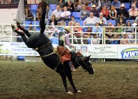MINOT, N.D. -- Cole Ershere of Faith, S.D., competes in the saddle bronc competition during the 2010 Y’s Men’s Rodeo here Oct. 8. The 56th annual Y’s Men’s Rodeo was held at the North Dakota State Fairgrounds Oct. 7 to 10 with all proceeds from the rodeo benefiting the YMCA’s Triangle Y Camp located near Garrison, N.D. (U.S. Air Force photo by Staff Sgt. Keith Ballard)