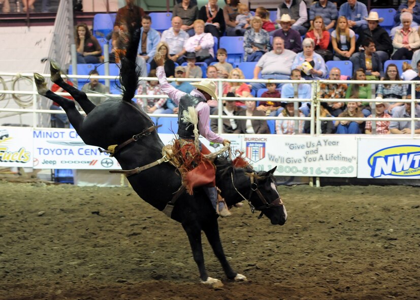 MINOT, N.D. -- Cole Ershere of Faith, S.D., competes in the saddle bronc competition during the 2010 Y’s Men’s Rodeo here Oct. 8. The 56th annual Y’s Men’s Rodeo was held at the North Dakota State Fairgrounds Oct. 7 to 10 with all proceeds from the rodeo benefiting the YMCA’s Triangle Y Camp located near Garrison, N.D. (U.S. Air Force photo by Staff Sgt. Keith Ballard)