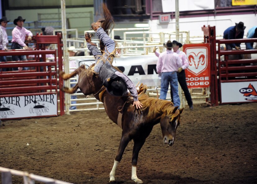 MINOT, N.D. -- Cleve Schmidt of Belle Fourche, S.D., attempted to compete in the bareback bronc competition with a broken arm and found out the hard way how unforgiving wild horses can truly be during the 2010 Y’s Men’s Rodeo here Oct. 8. The 56th annual Y’s Men’s Rodeo was held at the North Dakota State Fairgrounds Oct. 7 to 10 with all proceeds from the rodeo benefiting the YMCA’s Triangle Y Camp located near Garrison, N.D. (U.S. Air Force photo by Staff Sgt. Keith Ballard)