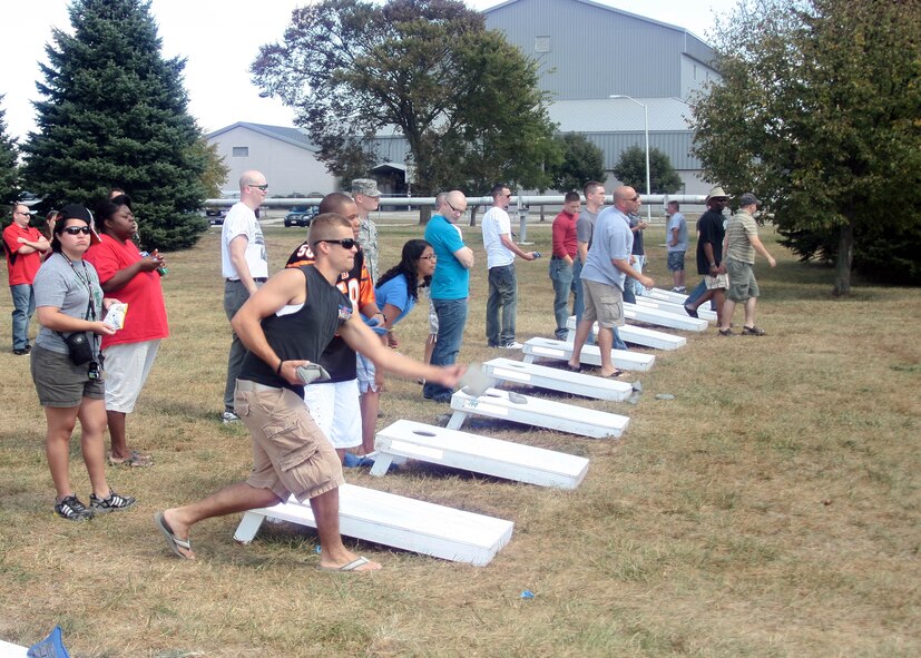 WRIGHT-PATTERSON AIR FORCE BASE, Ohio - Picnic attendees play a game of cornhole at the 445th Airlift Wing picnic Sept. 12. The picnic gave AIrmen a chance to bring their families and enjoy the last few days of summer.  (U.S. Air Force photo/Senior Airman Matt Cook)