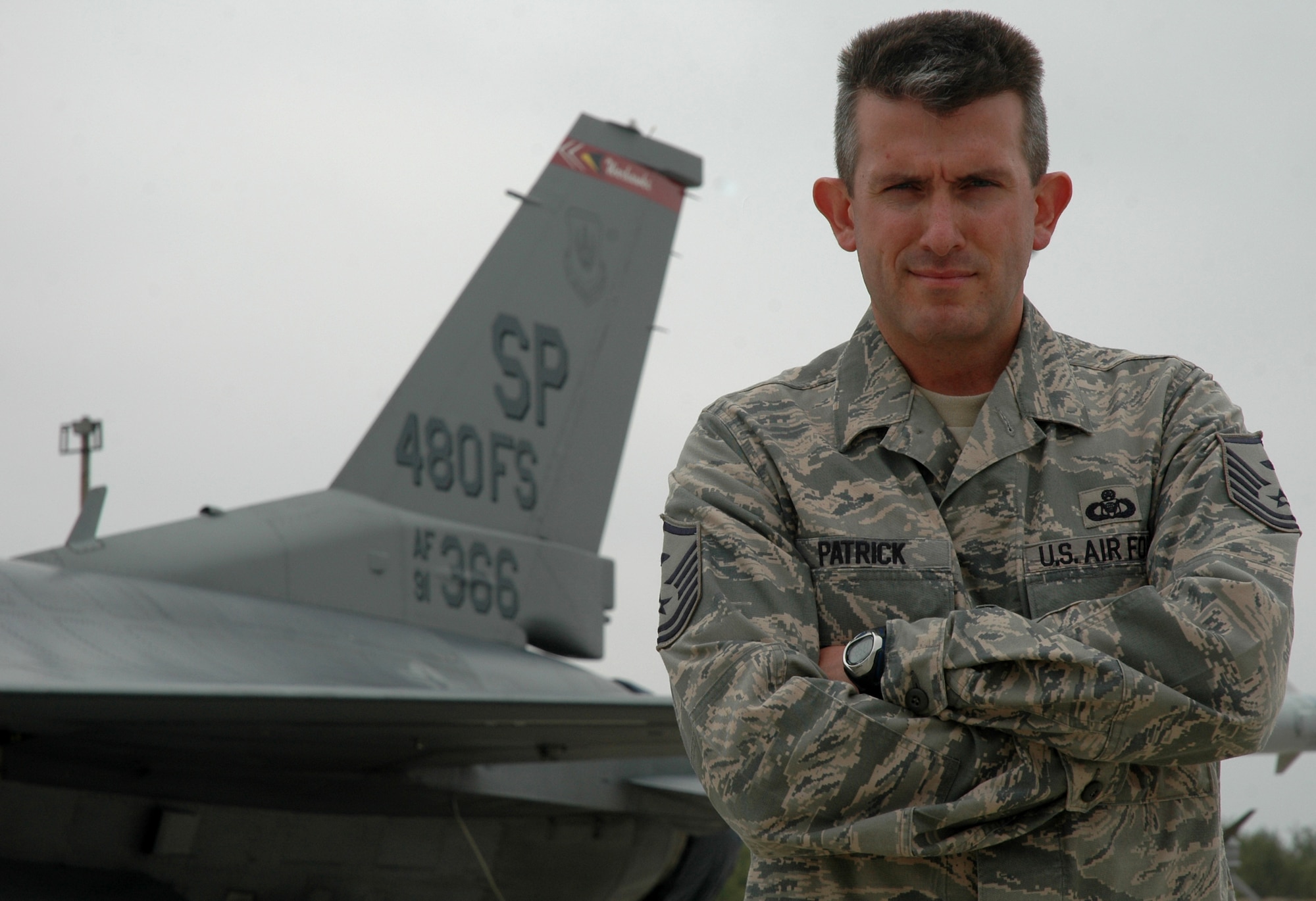 Master Sgt Michael Patrick, 480th Fighter Squadron First Sergeant, stands in front of an F-16 Fighting Falcon bearing his squadron's tailflash Oct. 13 during Operation Thracian Star. Sergeant Patrick returned to the 480th FS after nearly 20 years to serve as the First Sergeant for the three-week combined exercise that gave both U.S. and Bulgarian Airmen the opportunity to train together and strengthen relationships. (U.S. Air Force photo/Maj. Jillian Torango)