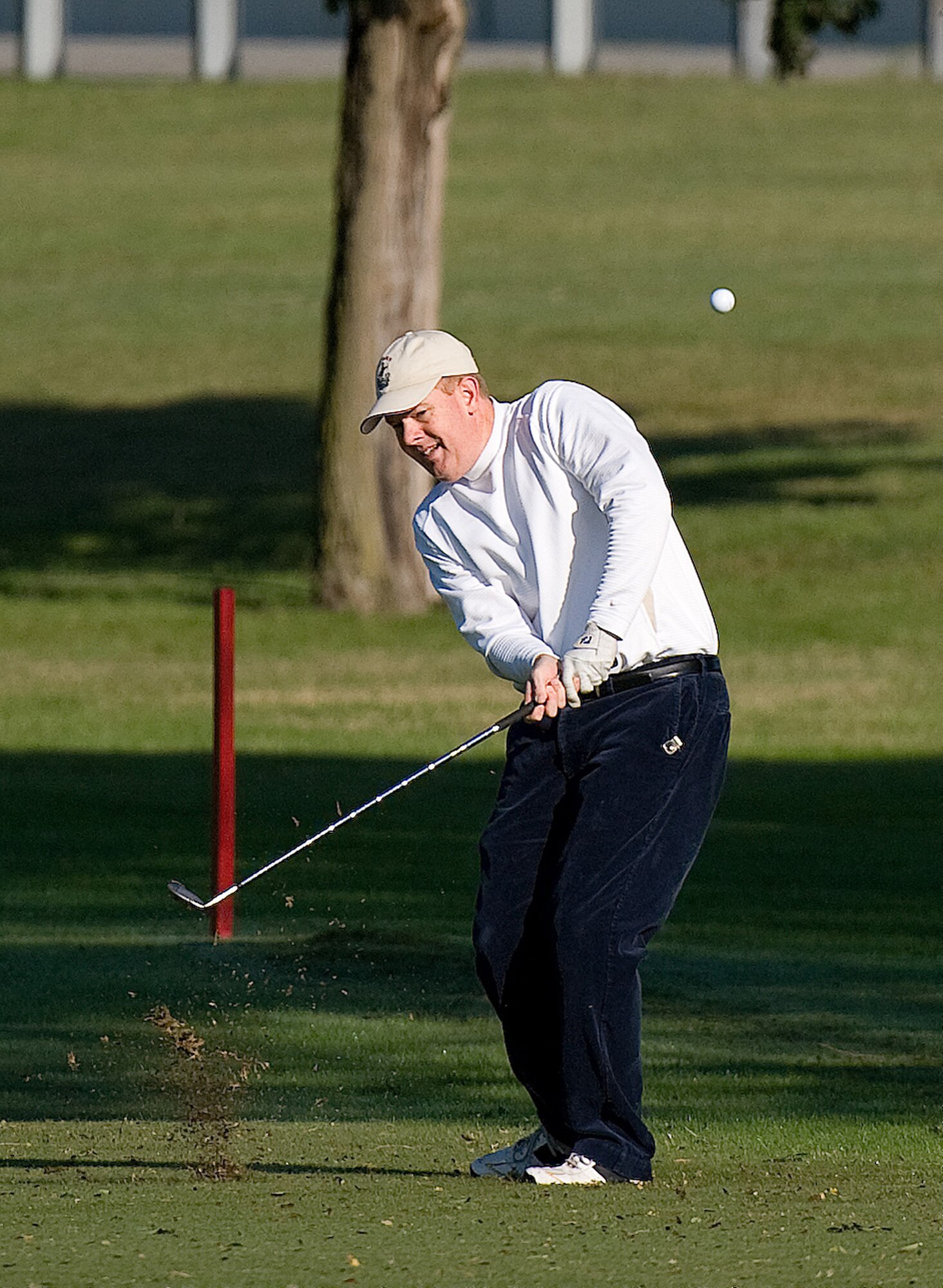 Lt. Col. Dale Landis, 436th Operation Support Squadron commander, shoots a chip-shot toward hole 10, during the Bluesuiters' Golf Tournament at Eagle Creek Golf Course at Dover Air Force Base, Del., Oct. 6, 2010. The Tournament brought local civilian leadership and Dover AFB leadership together on the green to build connections. (U.S. Air Force photo by Jason Minto/Released)