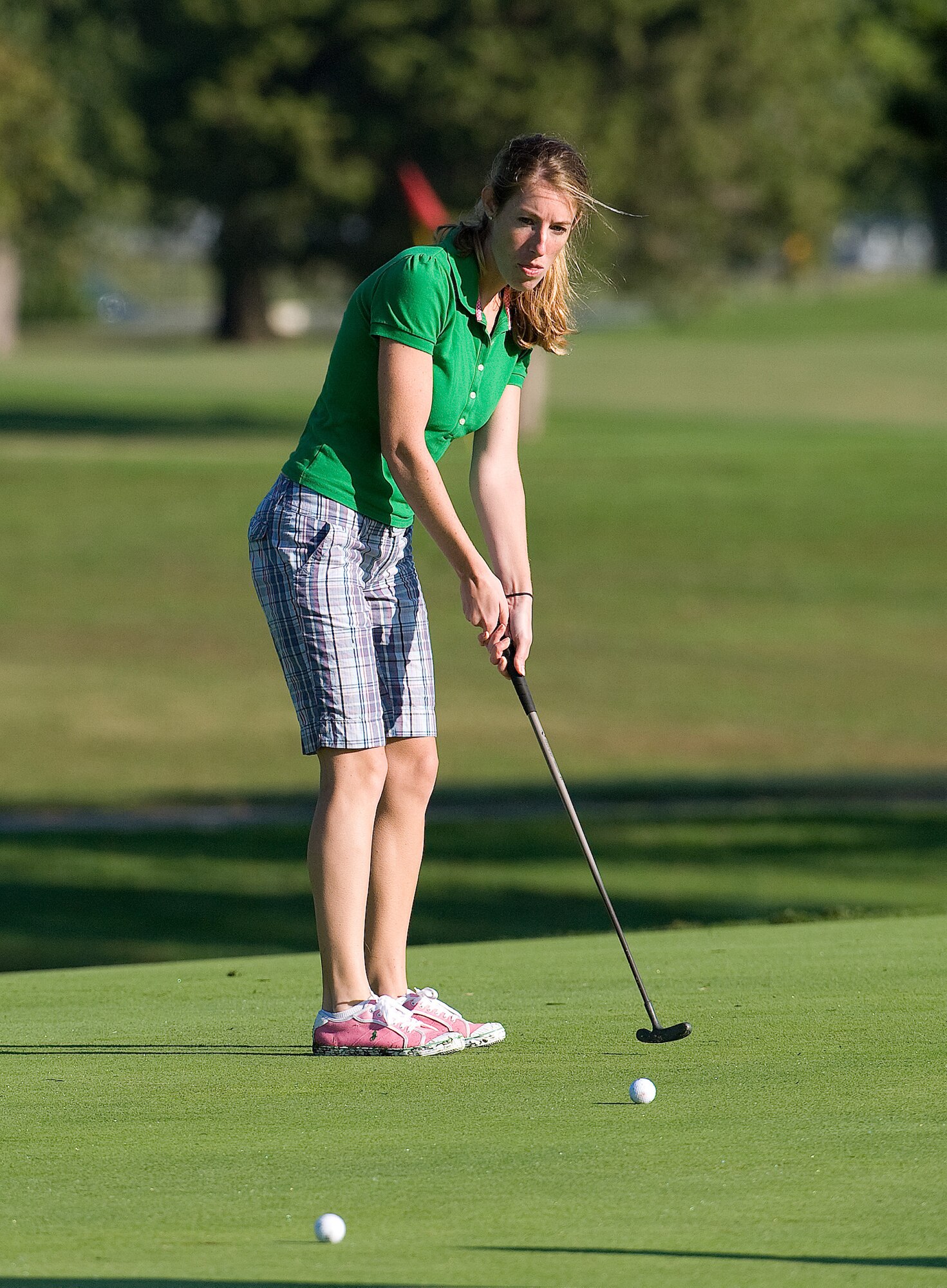 1st Lt. Abigail Wise, 436th Airlift Wing Public Affairs chief, lines up her put on hole 13, during the Bluesuiters' Golf Tournament at Eagle Creek Golf Course at Dover Air Force Base, Del., Oct. 6, 2010. The Tournament brings local civilian leadership on base to meet with wing leadership. (U.S. Air Force photo by Jason Minto/Released)