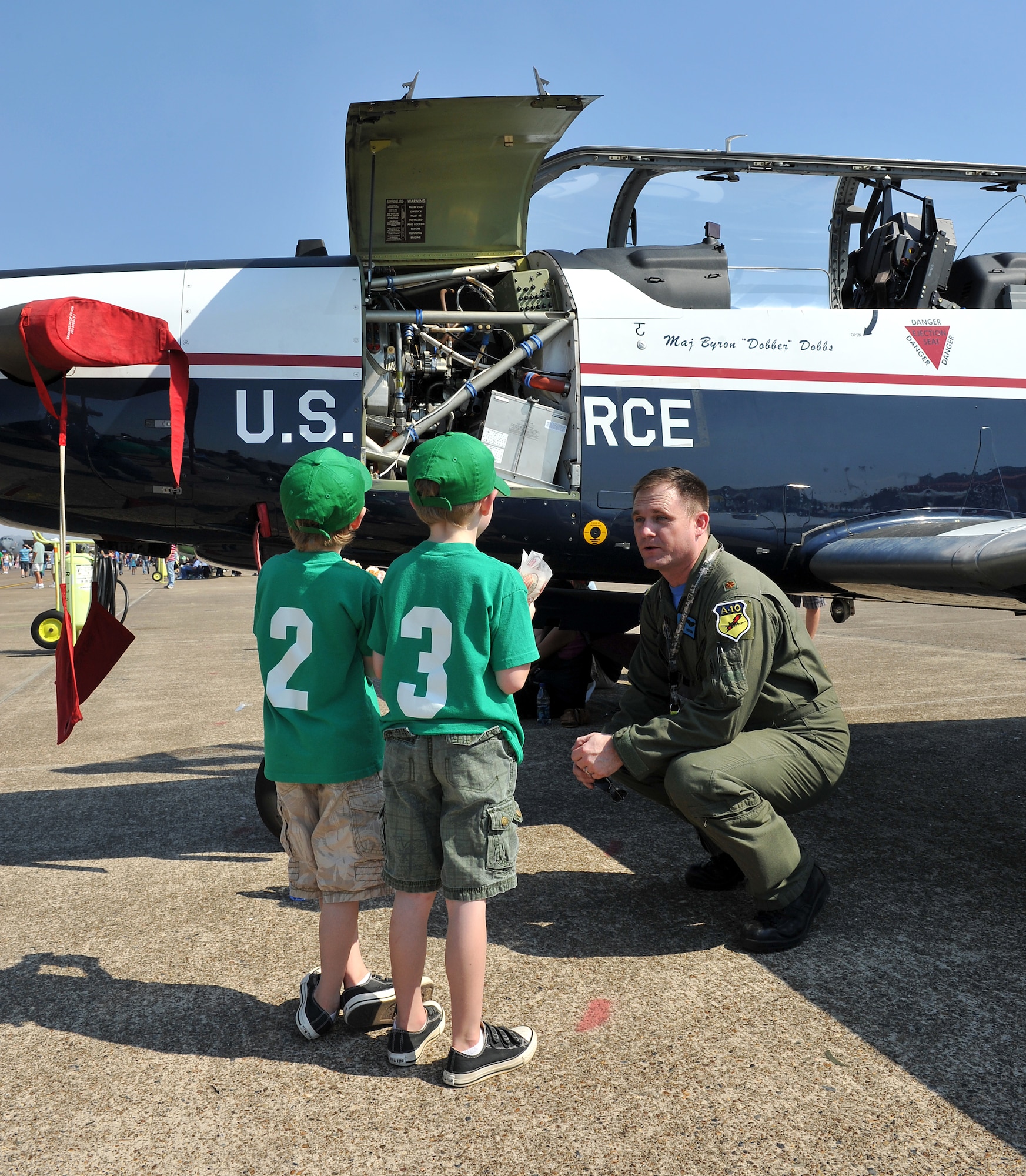 Maj. Al Caldwell, 80th Operations Support Squadron chief of student training of Sheppard Air Force Base, Texas, shows off a T-6A Texan II aircraft to William and Andrew Buck Oct. 9 during the Little Rock Air Force Base air show. Approximately 225,000 guests attended the Thunder Over the Rock air show which had more than five hours of flying demonstrations and more than 40 static displays. (U.S. Air Force photo by Staff Sgt. Chris Willis)