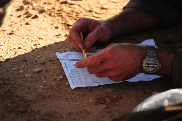 DAVIS-MONTHAN AIR FORCE BASE, Ariz. - Navigating over rough terrain is just one of the many skills Air Force Reserve pararescuemen or PJs deployed from Patrick Air Force Base, Fla., proved they excelled in during a weeklong pararescue rodeo competition October 4-10, 2010 in Tucson Ariz. Seven PJ teams throughout the nation were required to navigate through the hot desert during a simulated rescue mission. Other events they competed in required skills PJs must use to perform their job of saving lives. These skills included: free-fall parachuting, shooting, combat movements, medical and navigation. The Florida PJs, Reservists assigned to the 920th Rescue Wing, placed third among the teams.  (U.S. Air Force photo/Airman First Class Jerilyn Quintanilla)