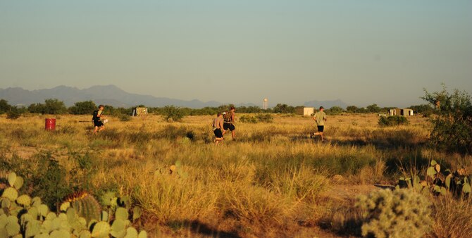 DAVIS-MONTHAN AIR FORCE BASE, Ariz. - A four-man Air Force Reserve pararescueman team from the 920th Rescue Wing, Patrick Air Force Base, Fla., race through the Arizona desert during a nine-mile combat skills and navigation competition. This was one of seven teams competing during a weeklong training event that pitted seven active duty and Reserve pararescue teams against each other. The events exercised skills they are required to be proficient at to perform life-saving missions in combat. They included: professional shooting, free-fall parachuting, combat movements, medical and navigation. (U.S. Air Force photo/Airman First Class Jerilyn Quintanilla) 