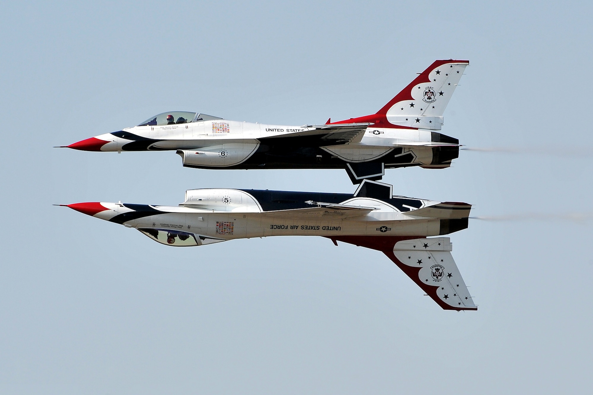 Air Force Thunderbirds No. 5 and 6 fly in a mirror formation Oct. 10 during the base’s air show and open house. Thunderbird No. 5 is flown by Hot Springs native Maj. Rick Goodman and No. 6 is flown by Capt. Aaron Jelinek. (U.S. Air Force photo by Staff Sgt. Chris Willis)