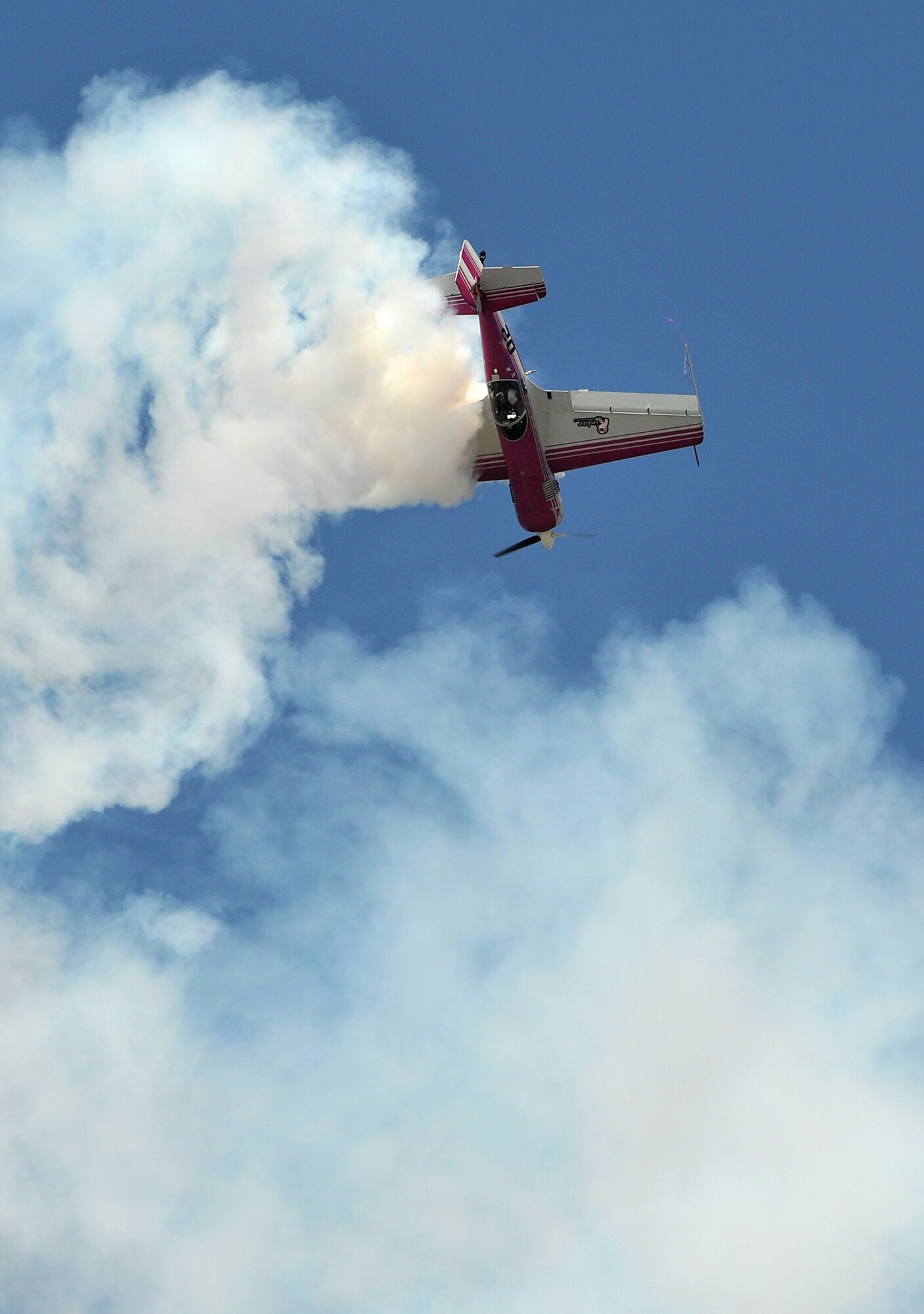 Mike Rinker draws shapes in the sky with his aircraft, Pink Floyd, Oct. 10 during the Thunder Over the Rock air show and open house. Pink Floyd is a Russian-built Sukhoi SU-26m, one of the first aircraft brought into the U.S. (U.S. Air Force photo by Staff Sgt. Chris Willis)