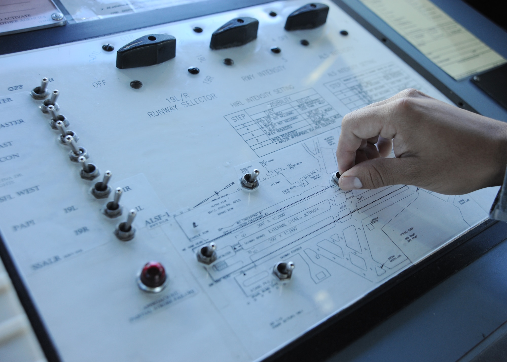 Controllers in McConnell’s air traffic control tower can control the lighting for the entire airfield and the intensity of the lights.  This allows pilots, ground personnel and air traffic controllers to see clearer during nighttime and in low visibility conditions.  (U.S. Air Force photo/Airman 1st Class Andrea Salazar)