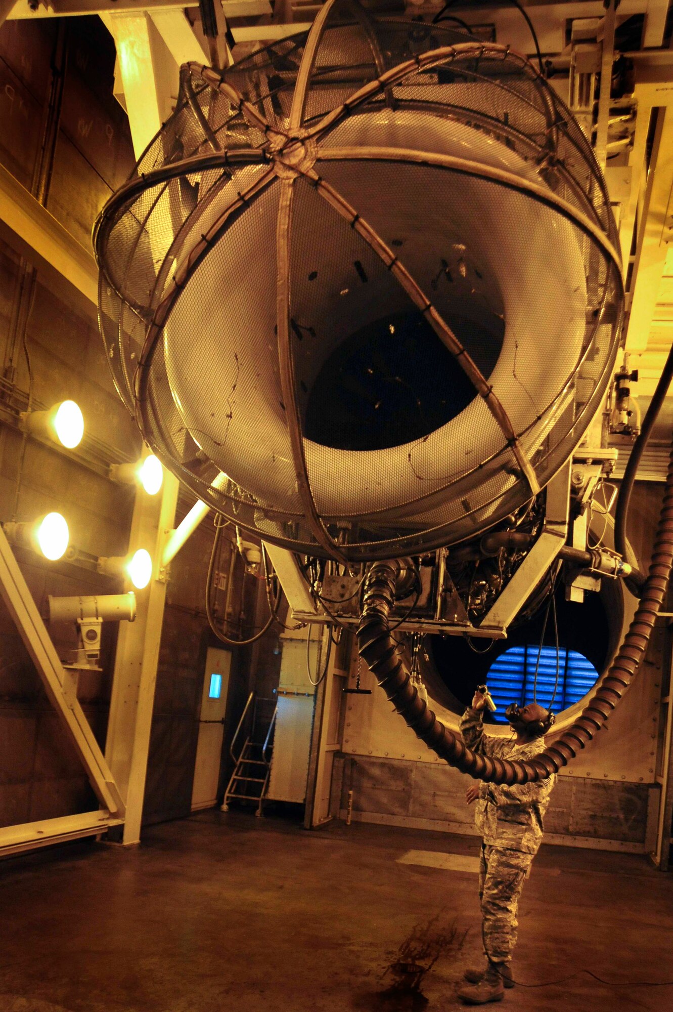 ELLSWORTH AIR FORCE BASE, S.D. – Tech. Sgt. Tywone Weston, 28th Maintenance Squadron aerospace propulsion test cell assistant NCO in-charge checks a B-1B Lancer General Electric F-101 turbofan engine for leaks, Oct. 6. The 28 MXS manages 138 F-101 engines to assist B-1 readiness. (U.S. Air Force photo/Senior Airman Corey Hook) 