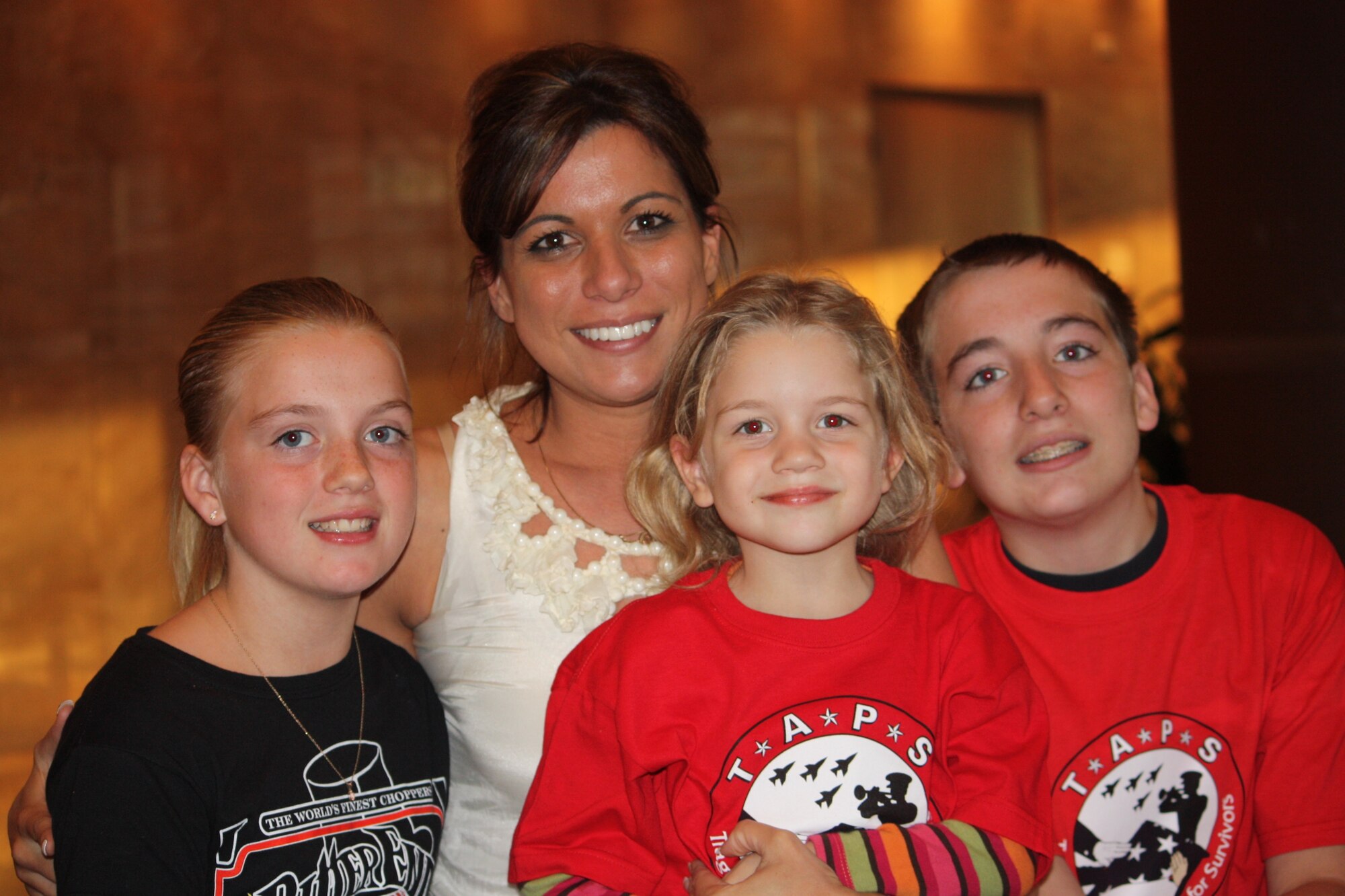 Miranda Kruse attends a Tragedy Assistance Program for Survivors Suicide Survivor Seminar in Alexandria, Va., with her three children, from left, McKayla, Elizabeth and Tristan, Oct. 8, 2010. Kruse sought help from TAPS following her husband's death in January 2006. (DOD photo/Elaine Wilson) 