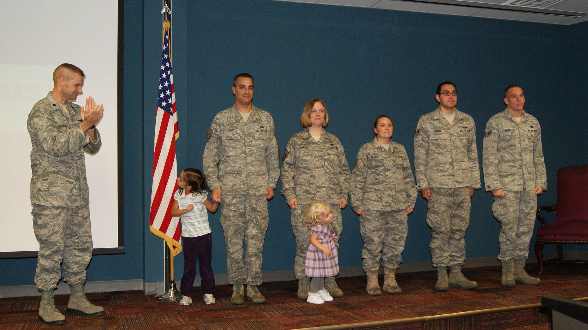 Lt. Col. Bruce Heseltine, commander of the 911th Air Refueling Squadron, congratulates five of his Airmen on their promotions during the month of October. (We can't officially recruit the little ones yet!) (USAF photo by MSgt. Wendy Lopedote, 916ARW/PA)