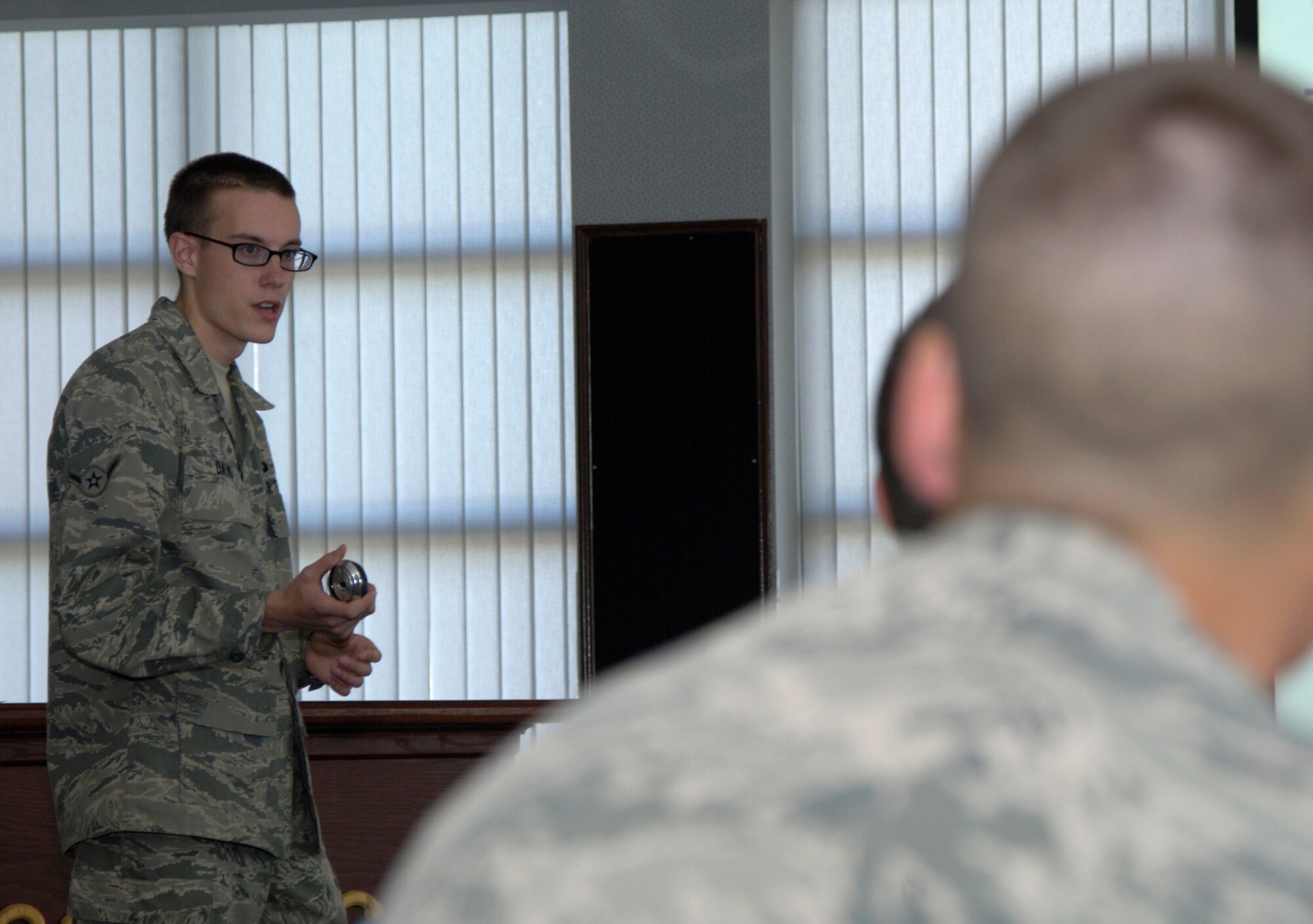 Airman Patrick Davis, 22nd Comptroller Squadron customer service technician, briefs the newest members of Team McConnell Oct. 12, 2010, McConnell Air Force Base, Kan. Airman Davis represents the 22nd CPTS during the right start briefing Tuesdays to inform incoming Airmen about finance’s capabilities. The Columbus, Ohio, native also helps approximately 30 customers a day with finance questions and issues.  (U.S. Air Force photo/Airman 1st Class Armando A. Schwier-Morales) 