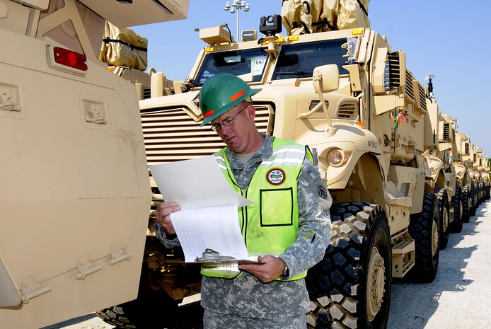 Army Staff Sgt. Pernell Anderson conducts an overall spot inspection and verifies equipment serial numbers Oct. 12, 2010, on Joint Base Charleston-Weapons Station, S.C., for the Mine-Resistant, Ambush-Protected All-Terrain Vehicles that are prepositioned for loading on a ship. Staff Sergeant Anderson is attached to 841st Transportation Battalion located on Joint Base Charleston-Weapons Station. (U.S. Navy photo by Mass Communication Specialist 1st Class Jennifer R. Hudson)