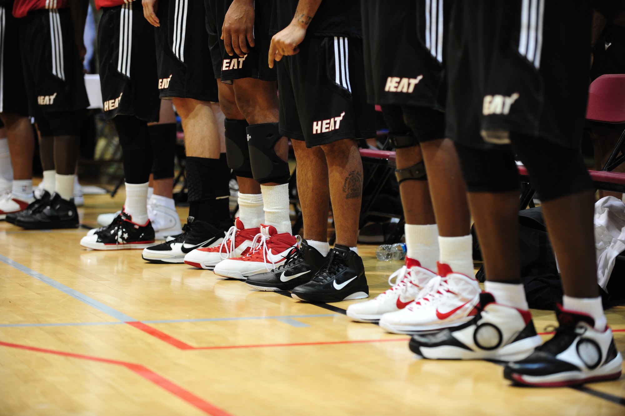Miami HEAT players stand as the base's Honor Guard posts the colors before the scrimmage at Hurlburt Field Fla., Oct. 1, 2010. The HEAT took time out from their training camp to display their skills in front of more than 500 Hurlburt and Eglin Air Force Base Airmen, DoD Civilians and dependents. (DoD Photo by Staff Sgt. Stephanie Jacobs/RELEASED)
