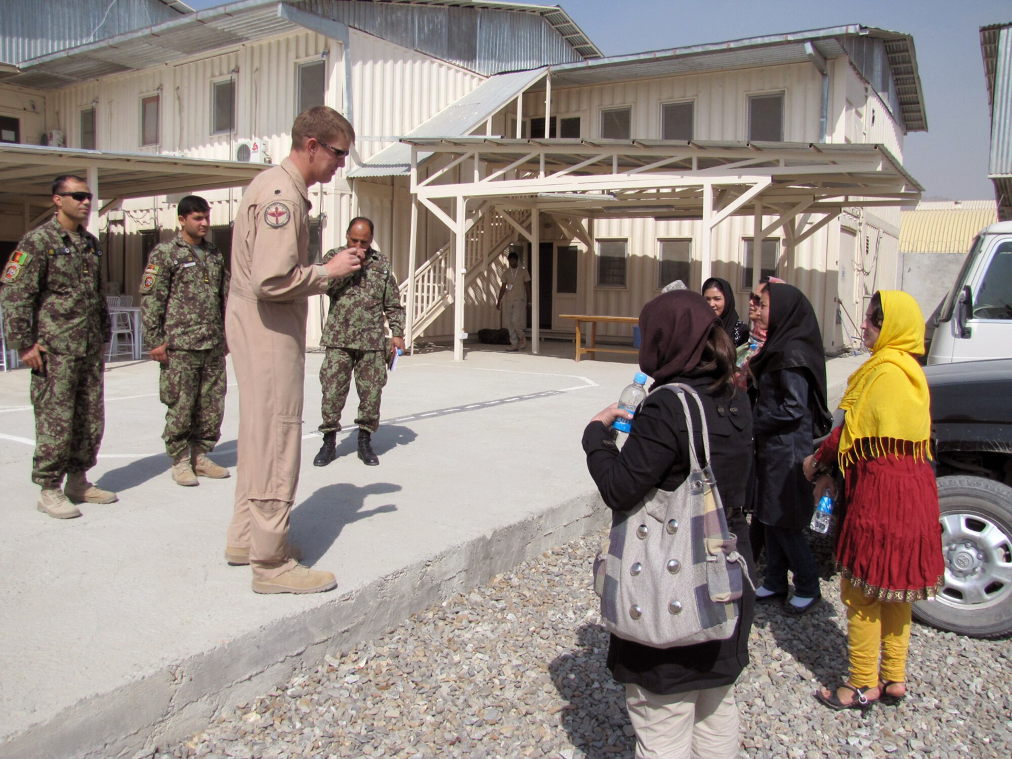 Five newly commissioned female Afghan lieutenants arrive Oct. 12, 2010, at the Thunder Lab in Kabul, Afghanistan. (U.S. Navy photo/Petty Officer 1st Class Elizabeth Burke)
