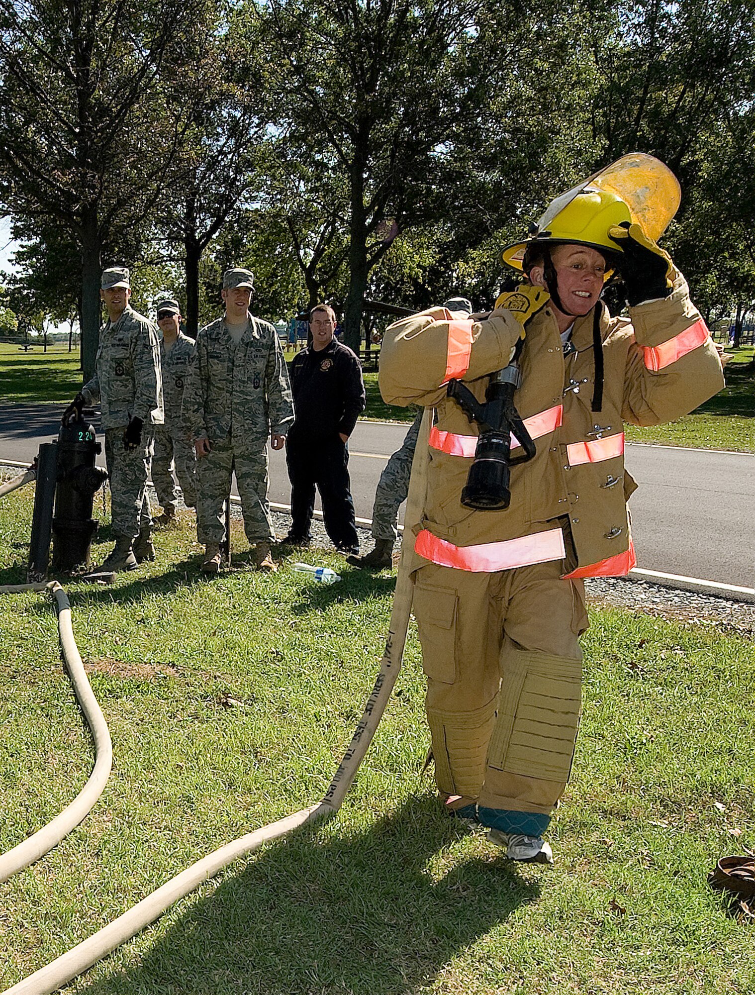 Col. Joan Garbutt, 436th Mission Support Group commander, runs the last leg of the Fire Muster competition at Dover Air Force Base, Del., Oct. 7, 2010. The Fire Muster competition pitted different teams against each other in challenges that mirrored those of firefighters. (U.S. Air Force photo by Jason Minto/Released)