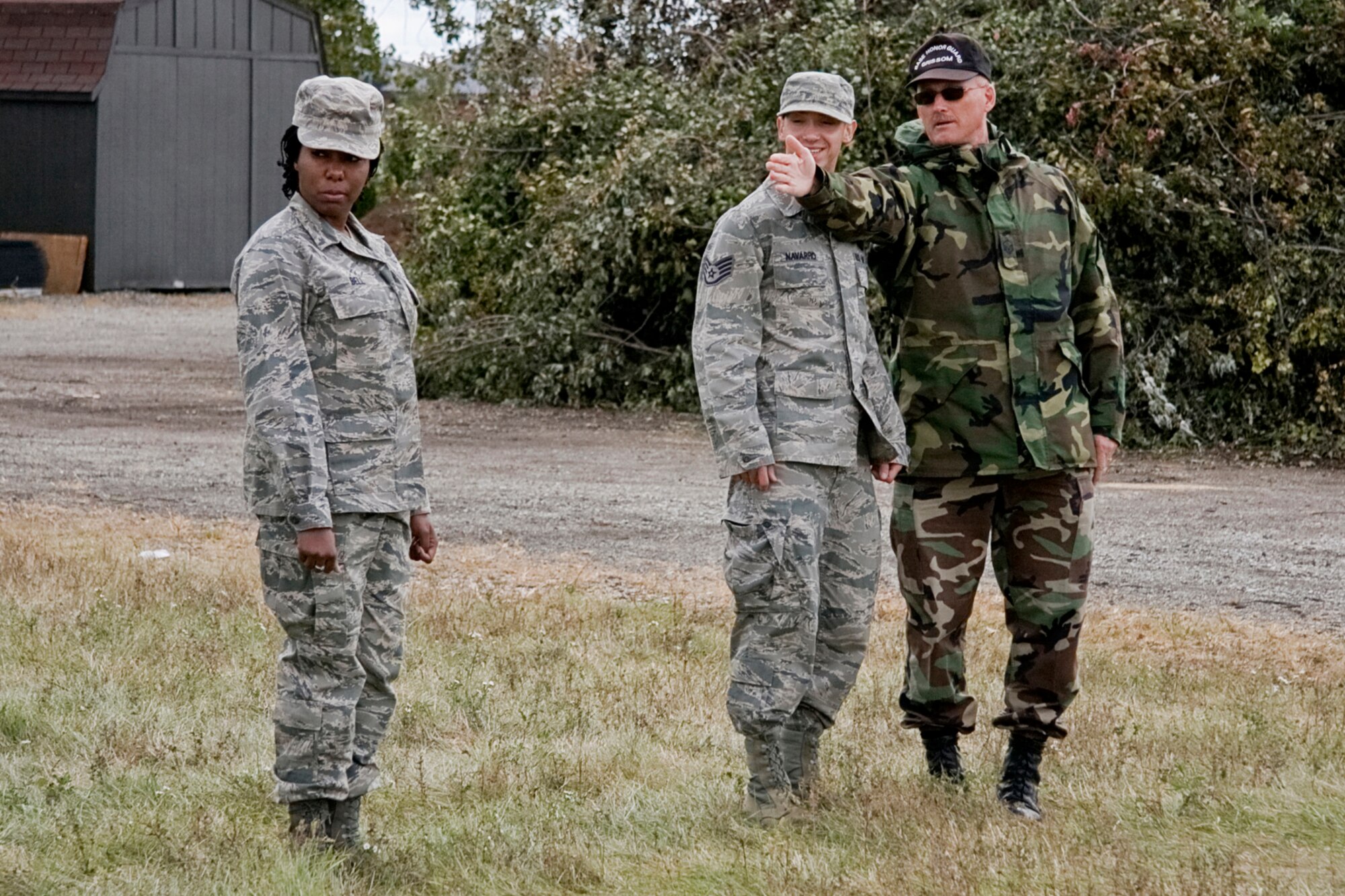 GRISSOM AIR RESERVE BASE, Ind. -- Master Sgt. Tim Wood explains the importance of a straight line to Staff Sgt. George Navarro and Airman Basic Brittany Bell during a search and recovery exercise held by members of the 434th Services Flight here during the October unit training assembly. All three Airmen are services specialists with the 434th SVF and are part of a SAR team, which is responsible for recovering personal effects or remains after a fatal event. (U.S. Air Force photo/Tech. Sgt. Mark R. W. Orders-Woempner)