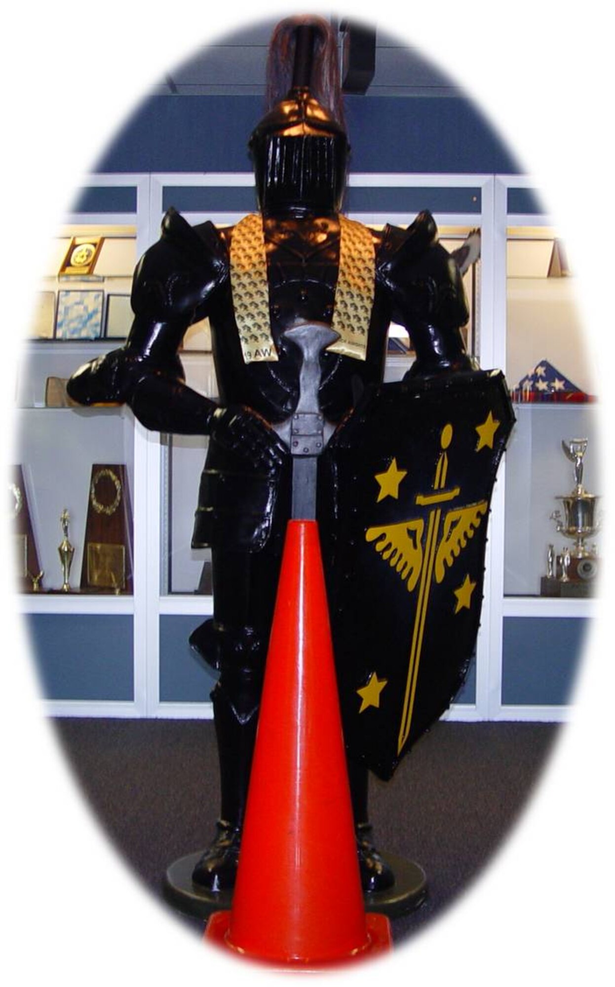 Rodney, the 19th Airlift Wing official Black Knight mascot, with an orange construction cone, the base's new unofficial mascot. (Courtesy photo illustration)
