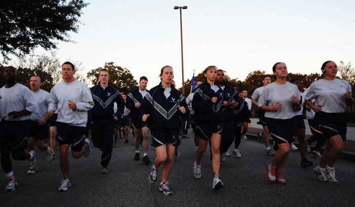 Airmen dash off as the horn sounds at the beginning of the Commander's Fitness Challenge run Oct. 8, 2010, on Joint Base Charleston, S.C. This month's fitness challenge kicked off the "Healthy Through the Holidays" program that the Health and Wellness Center is currently promoting. (U.S. Air Force photo/Senior Airman Timothy Taylor)