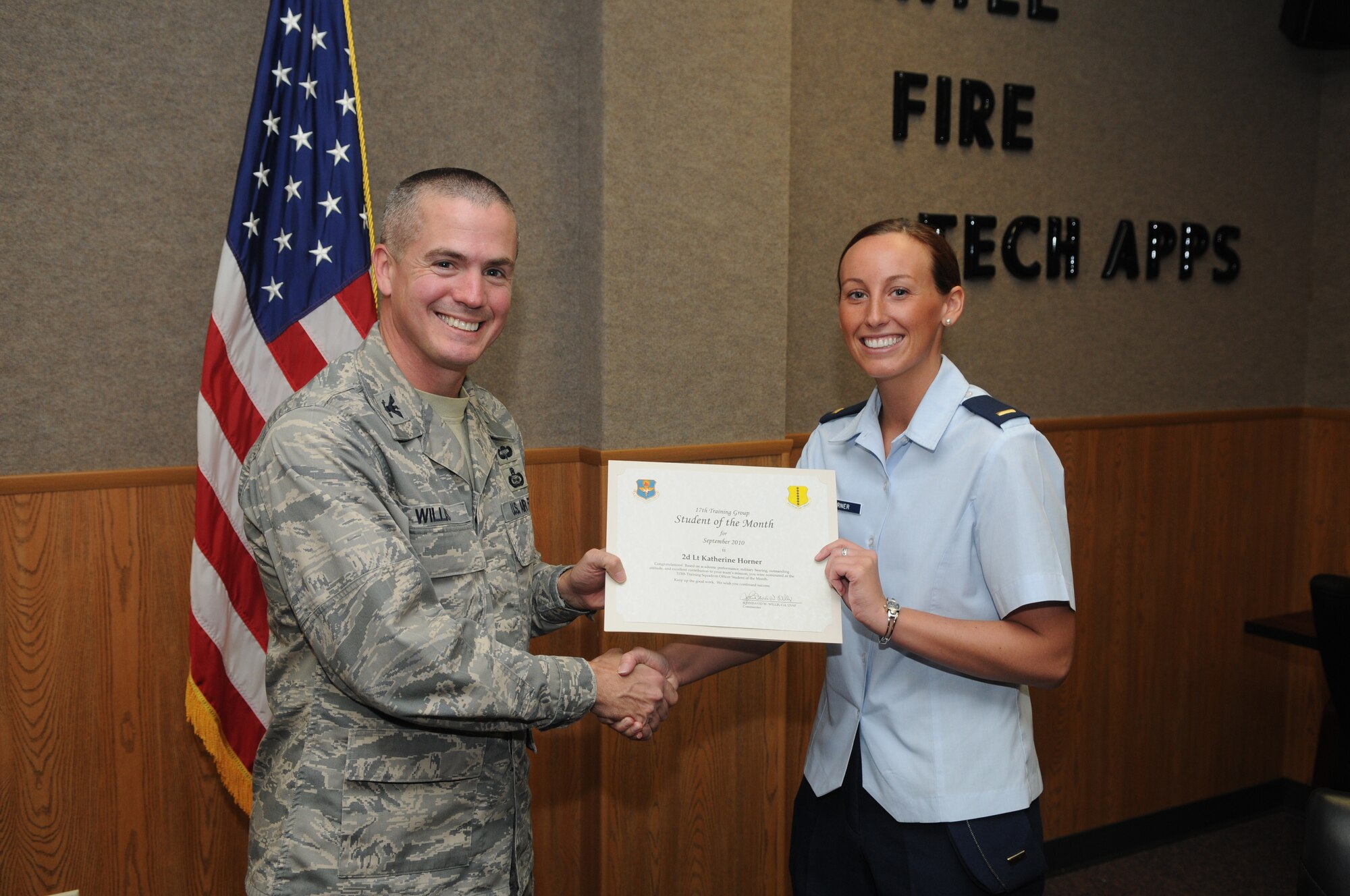 2nd Lt. Katherine Horner, 315th Training Squadron, accepts her September Student of the Month award from Col. J.D. Willis, 17th Training Group commander. (U.S. Air Force photo/Airman 1st Class Clayton Lenhardt)