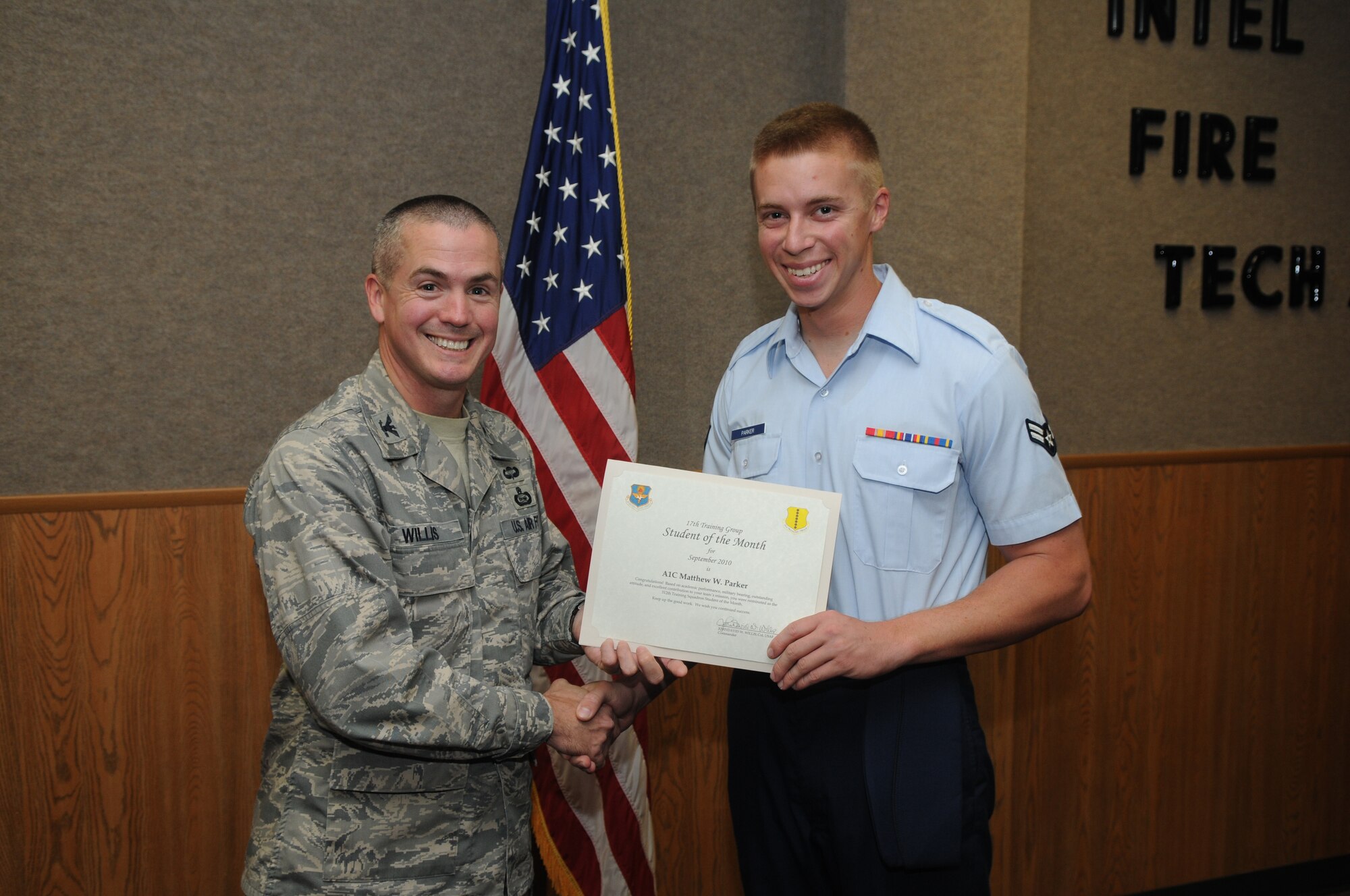Airman 1st Class Matthew Parker, 312th Training Squadron, accepts his September Student of the Month award from Col. J.D. Willis, 17th Training Group commander. (U.S. Air Force photo/Airman 1st Class Clayton Lenhardt)
