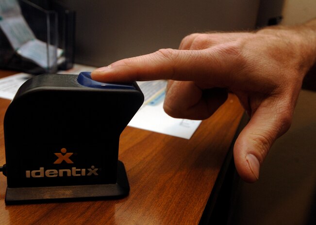 The Defense Biometric Identification System uses several pieces of information obtained from individuals for positive identification, including pictures and fingerprints. (U.S. Air Force photo/Senior Airman Timothy Taylor)