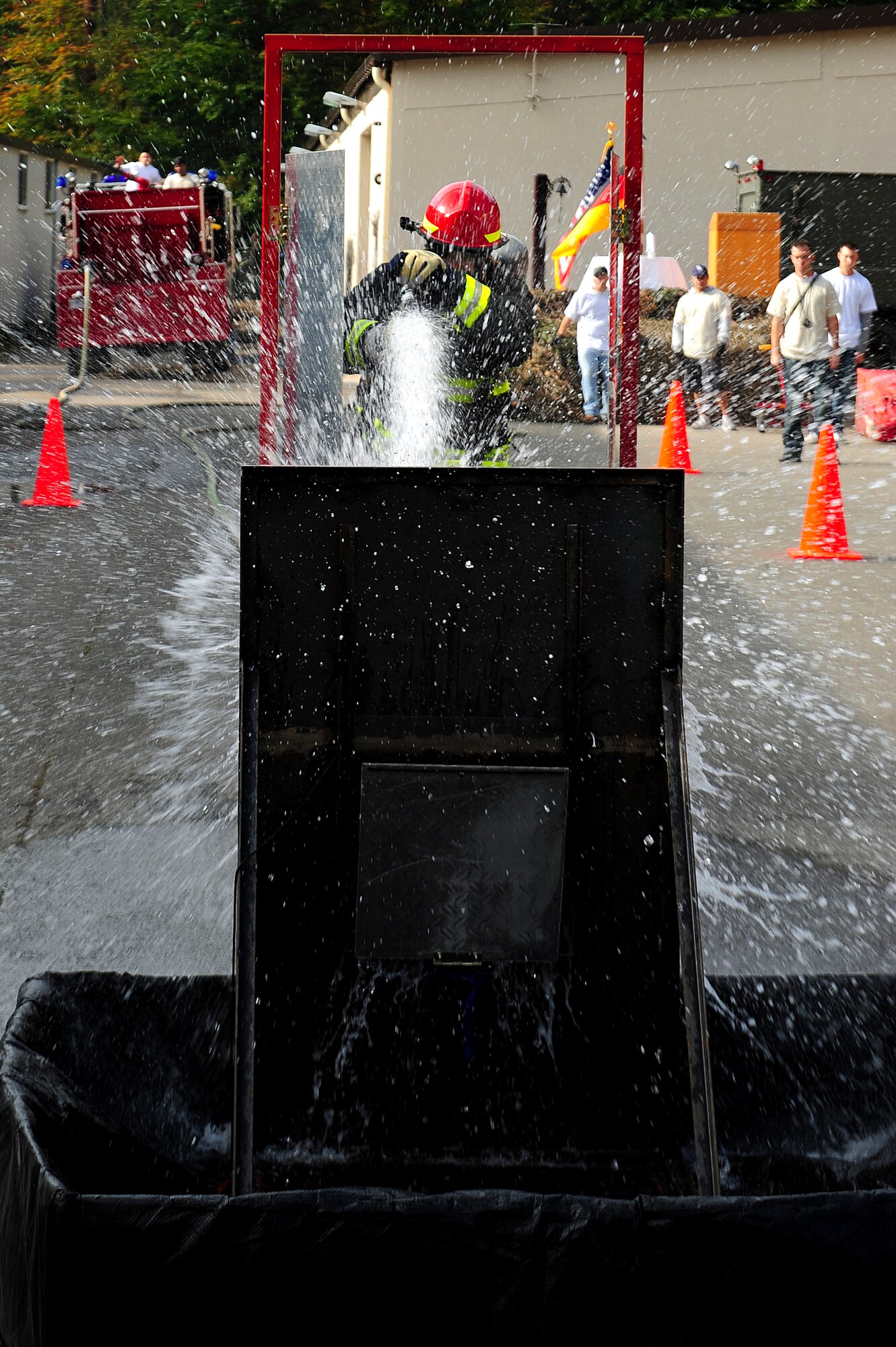 A U.S. Air Forces in Europe firefighter participates in a Firefighter Combat Challenge at the 435th Construction and Training Squadron contingency training site, Ramstein Air Base, Germany, Oct. 9, 2010. The competition consisted of a timed, five part obstacle course simulating real life challenges. (U.S. Air Force photo by Airman 1st Class Brea Miller)