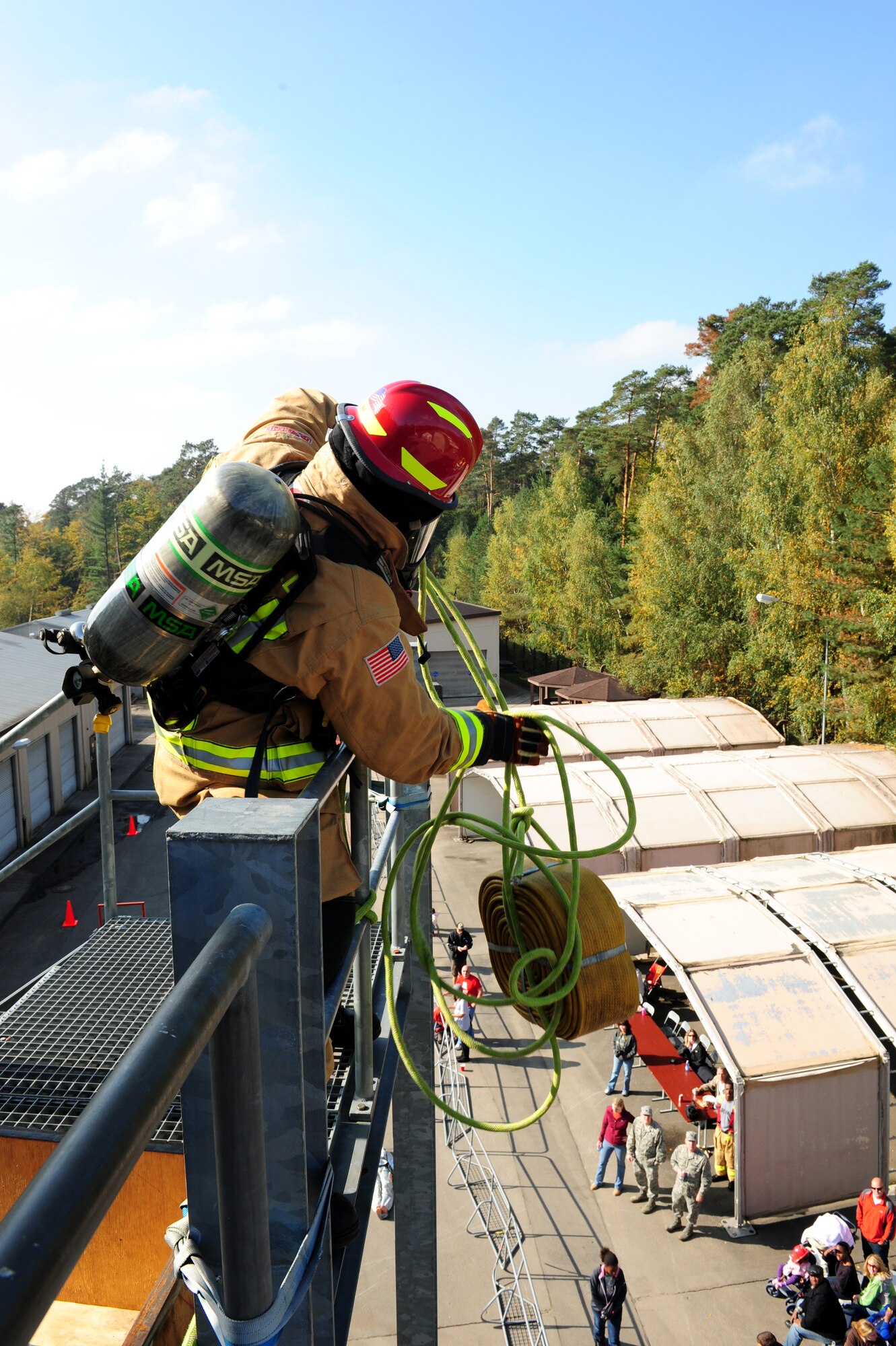 A U.S. Air Forces in Europe firefighter participates in a Firefighter Combat Challenge at the 435th Construction and Training Squadron contingency training site, Ramstein Air Base, Germany, Oct. 9, 2010. The competition consisted of a timed, five part obstacle course simulating real life challenges. (U.S. Air Force photo by Airman 1st Class Brea Miller)