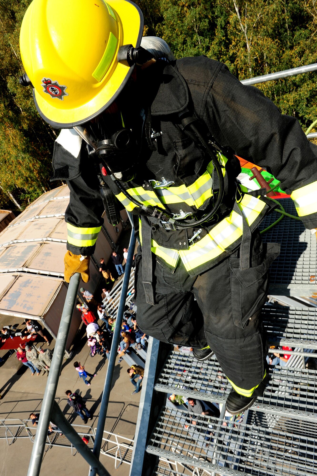 A U.S. Air Forces in Europe firefighter participates in a Firefighter Combat Challenge at the 435th Construction and Training Squadron contingency training site, Ramstein Air Base, Germany, Oct. 9, 2010. The competition consisted of a timed, five part obstacle course simulating real life challenges. (U.S. Air Force photo by Airman 1st Class Brea Miller)