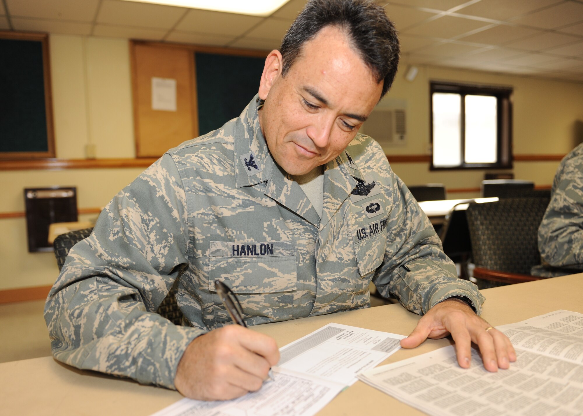KUNSAN AIR BASE, Republic of Korea -- Col. Hugh Hanlon, 8th Fighter Wing vice commander, signs his combined federal campaign form here Oct. 13, 2010. CFC is the world’s most successful annual workplace charity campaign, with more than 300 campaigns throughout the country and internationally to help raise millions of dollars each year. (U.S. Air Force photo/Senior Airman Ciara Wymbs) 