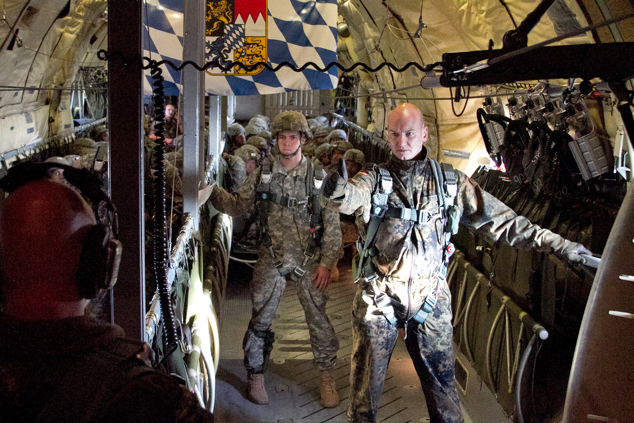 German Jumpmaster Staff Sgt Volker Metzig Gives The Okay Signal To The Loadmaster Of A German