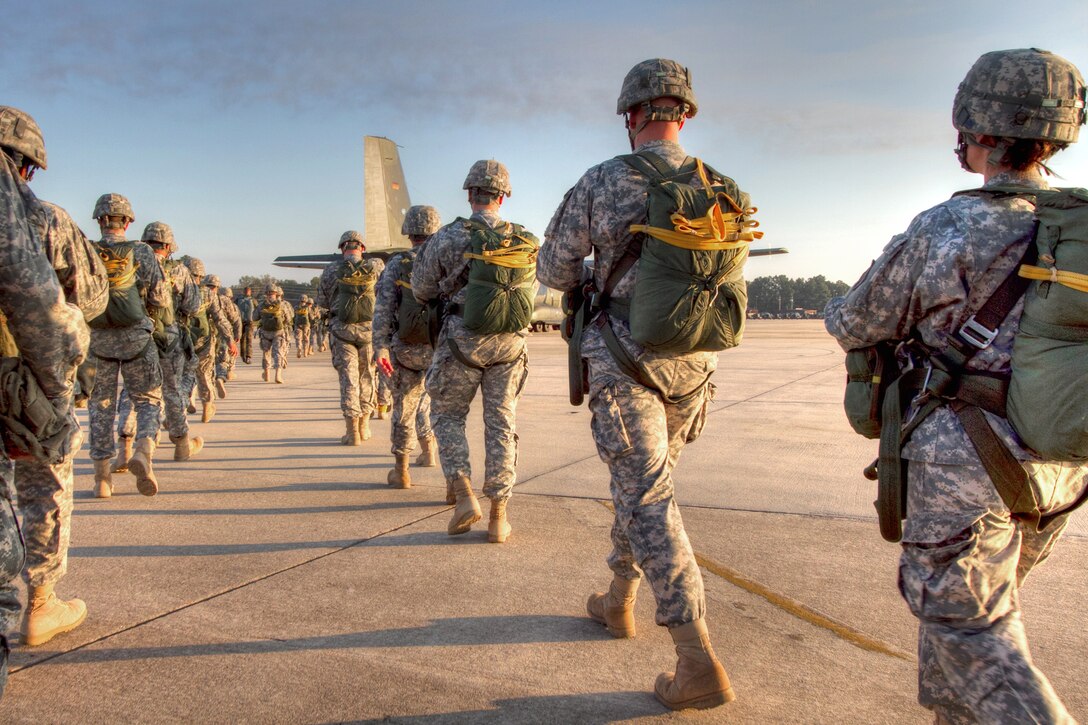 U.S. Army paratroopers approach a German C-160 aircraft on Pope Air Force Base, N.C., Oct. 5, 2010, to earn German Jump wings during Operation Federal Eagle.