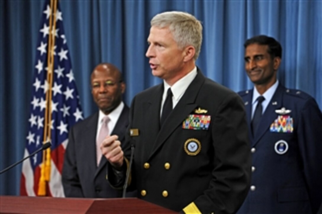 Commander of Navy Recruiting Command Rear Adm. Craig S. Faller talks about the successful fiscal year 2010 recruiting efforts of Navy recruiters nationwide during a Pentagon press briefing hosted by Under Secretary of Defense for Personnel and Readiness Clifford Stanley (left) on Oct. 12, 2010.  