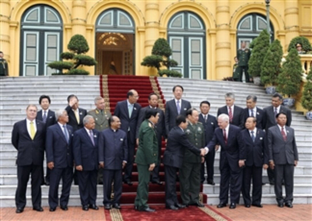 Defense ministers including Secretary of Defense Robert M. Gates (front row 3rd from right) and Vietnamese President Nguyen Minh Triet (front row 5th from right) gather to be photographed on the front steps of the Presidential Palace during the Association of Southeast Asian Nations Defense Ministers' Meeting Retreat in Hanoi, Vietnam, on Oct. 12, 2010.  