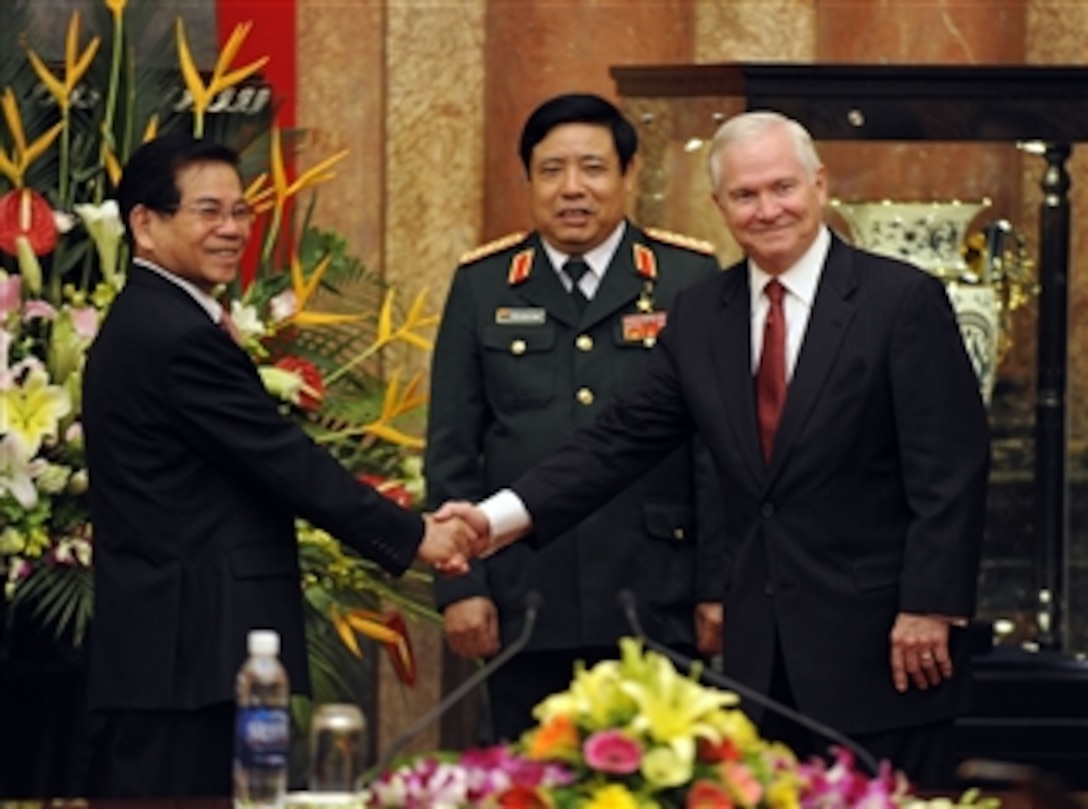 Secretary of Defense Robert M. Gates shakes hands with Vietnamese President Nguyen Minh Triet in the Presidential Palace during the Association of Southeast Asian Nations Defense Ministers' Meeting Retreat in Hanoi, Vietnam, on Oct. 12, 2010.  