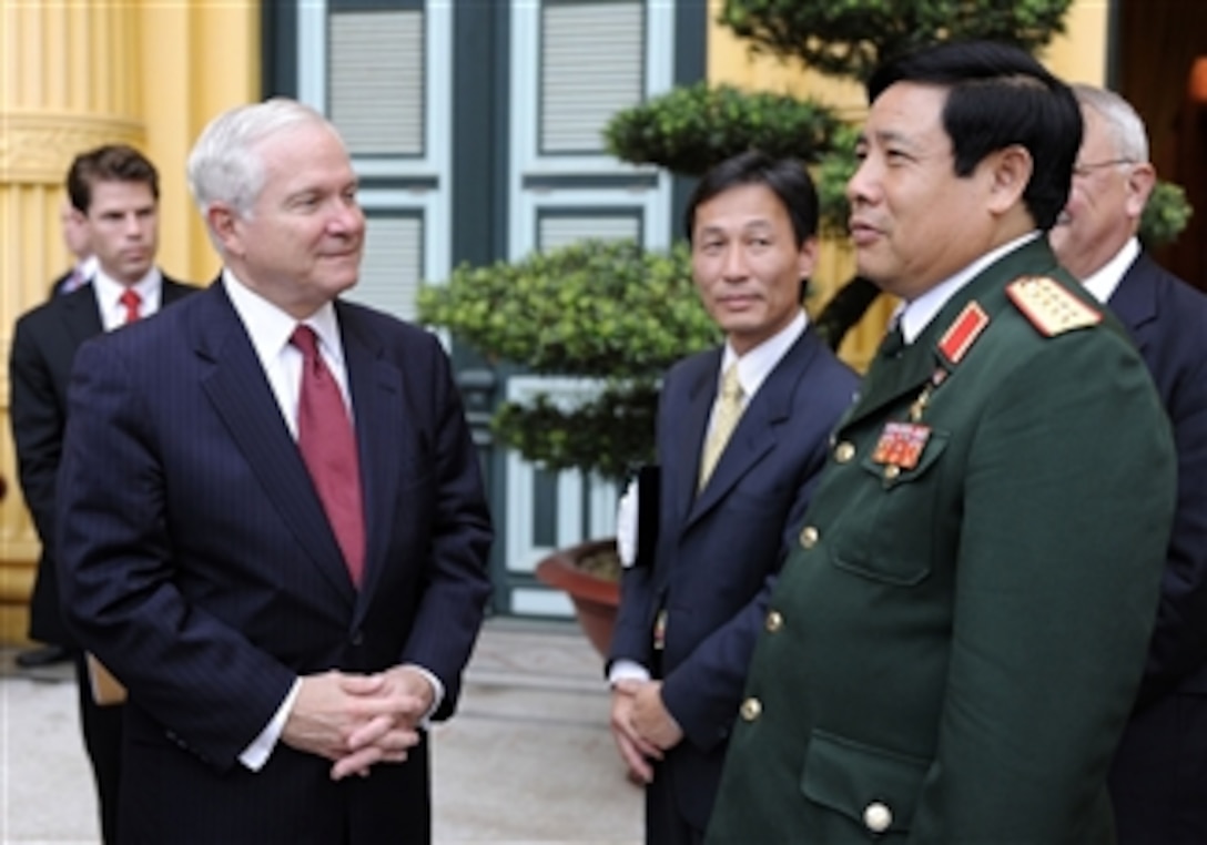 Secretary of Defense Robert M. Gates talks with Vietnamese Defense Minister Phung Quang Thanh in the Presidential Palace during the Association of Southeast Asian Nations Defense Ministers' Meeting Retreat in Hanoi, Vietnam, on Oct. 12, 2010.  
